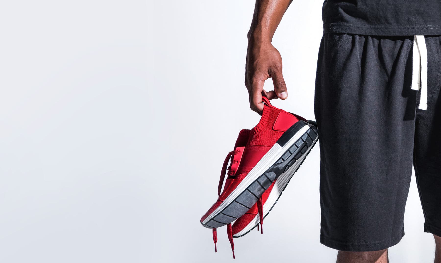 Athlete preparing shoes for performance training